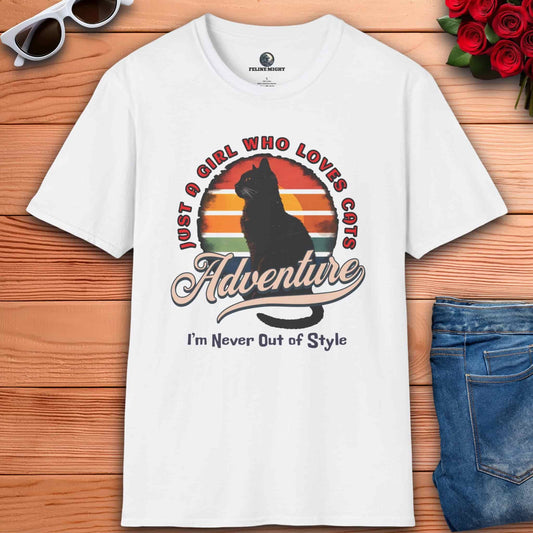 White t-shirt featuring a cat silhouette and retro colors with the phrase 'Just a Girl Who Loves Cats - I'm Never Out of Style'