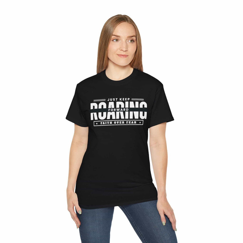 A black Just Just Keep Roaring Forward Quote Tee worn by a woman, embodying strength and resilience.