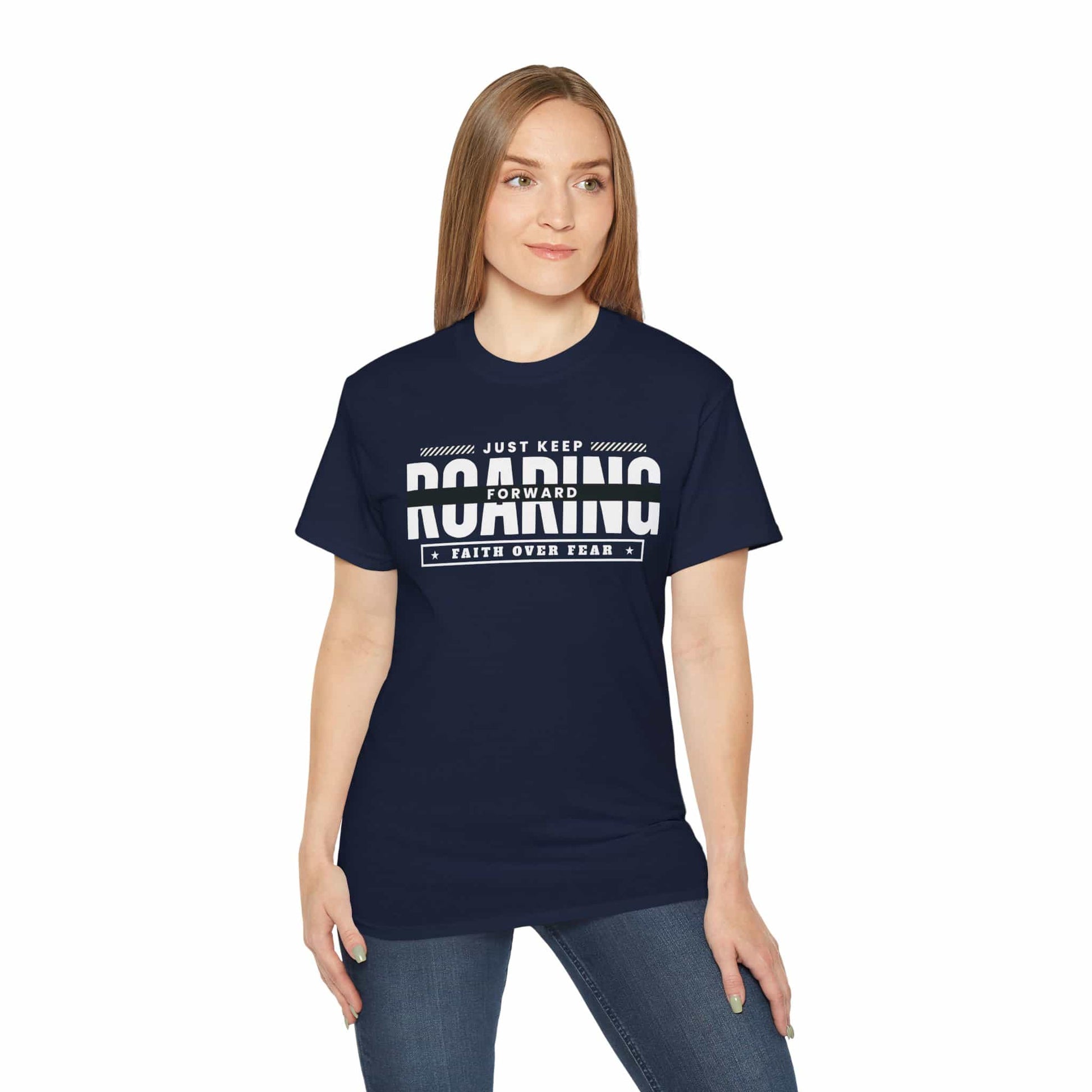 A navy blue Just Keep Roaring Forward T-Shirt worn by a woman, embodying strength and resilience.