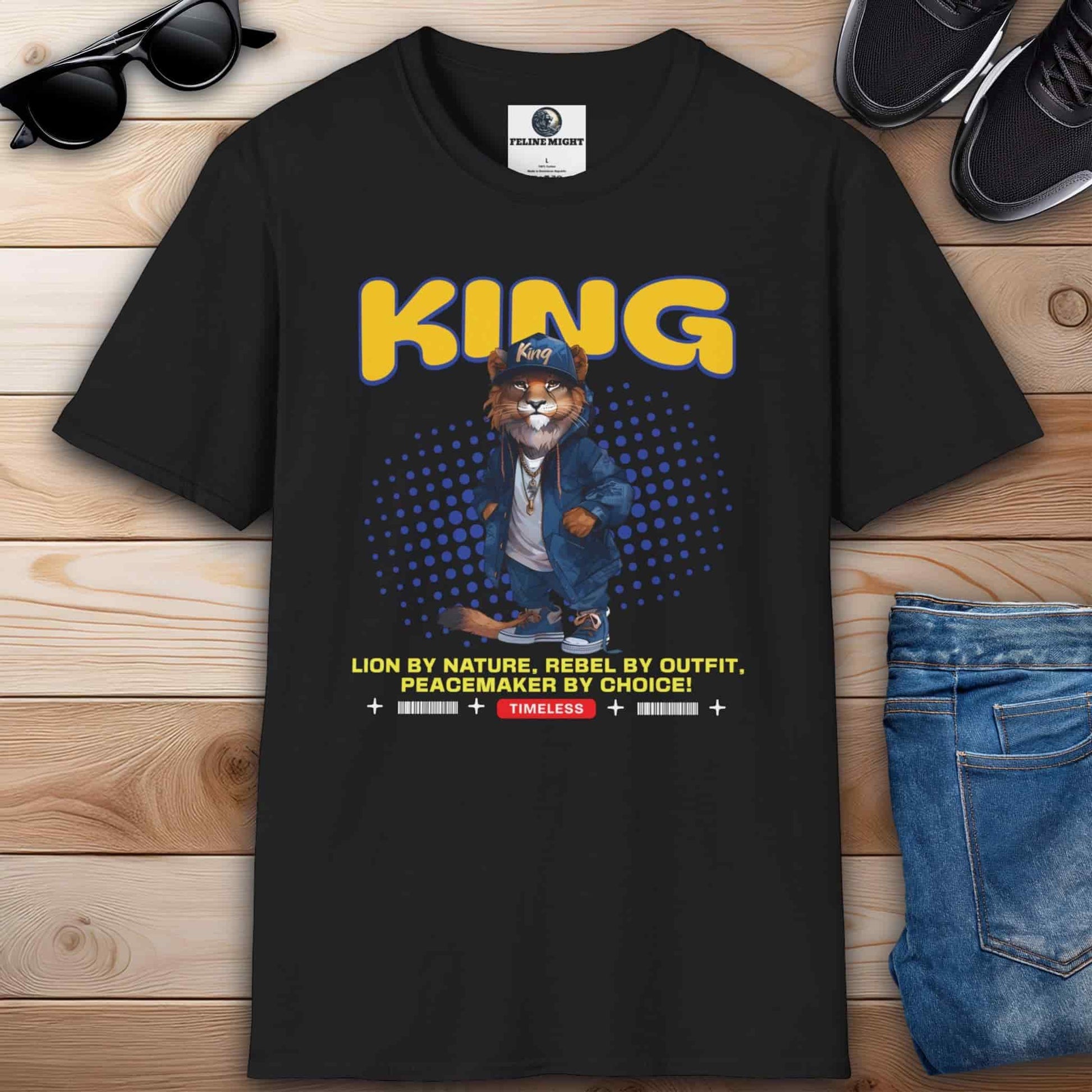 A stylish black t-shirt featuring a lion character with the word 'KING' and a catchy slogan.