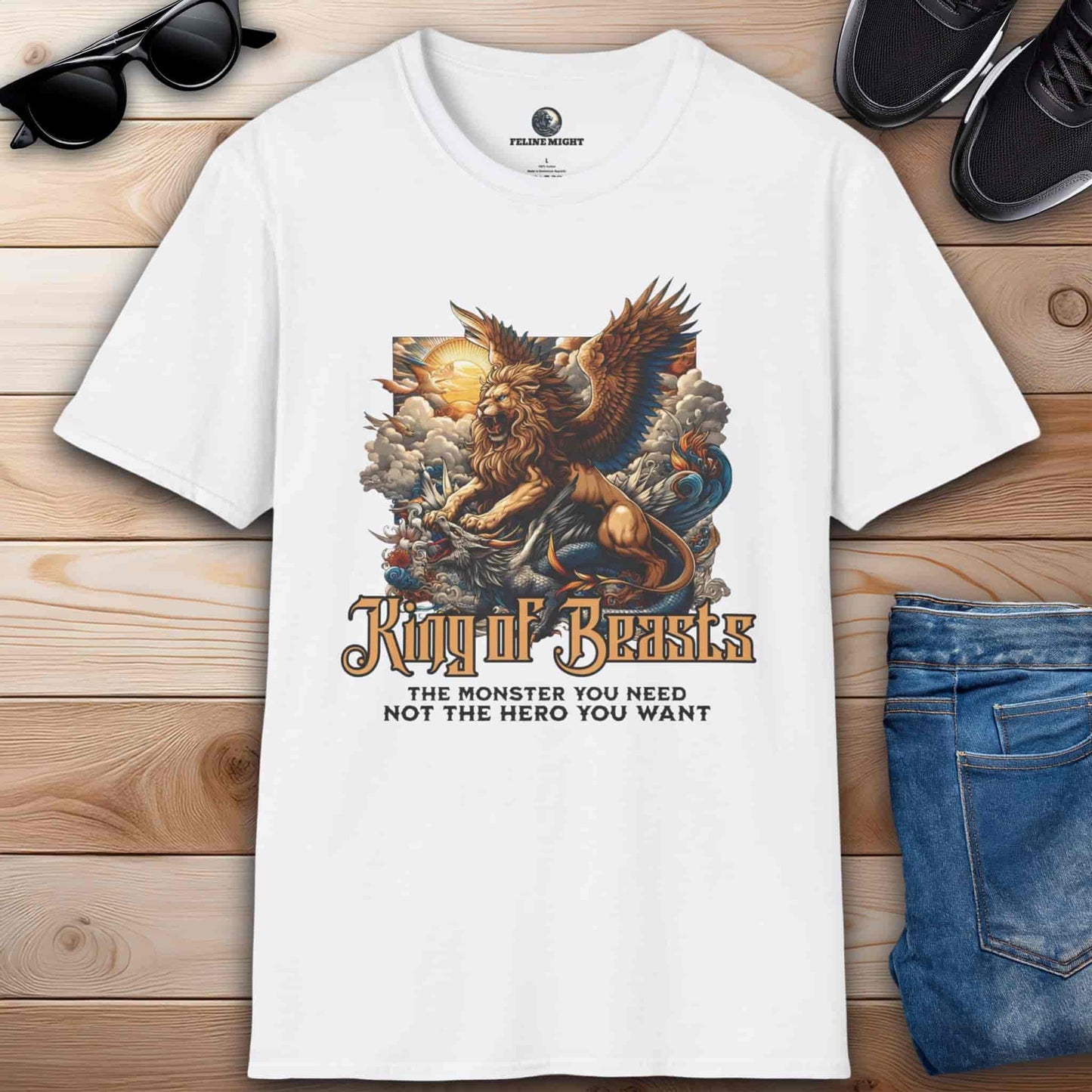 White t-shirt featuring a winged lion with the text 'King of Beasts: The Monster You Need, Not the Hero You Want.'