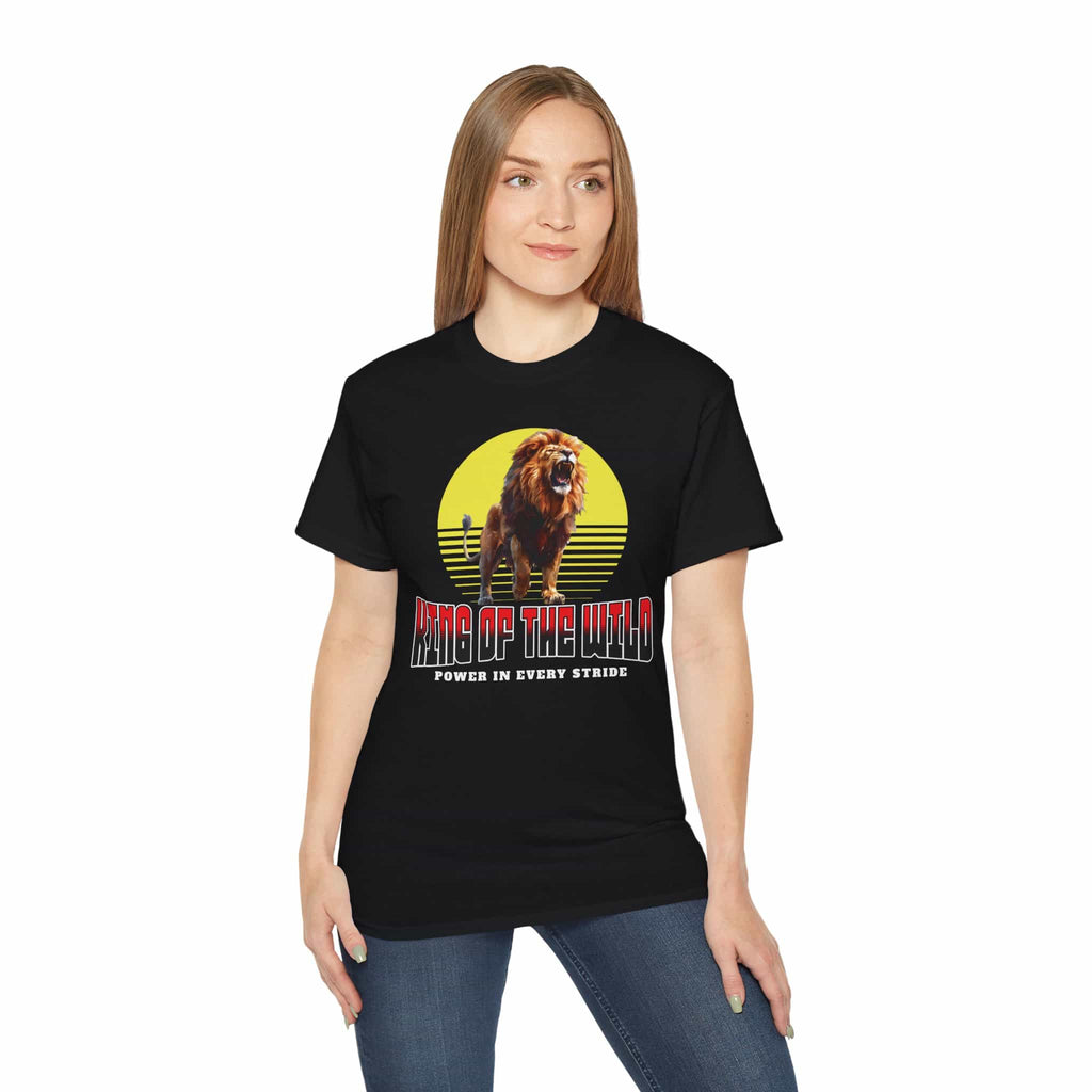 A woman wearing a black King of the Wild Lion T-Shirt featuring a bold lion graphic with the text 'King of the Wild - Power in Every Stride'.