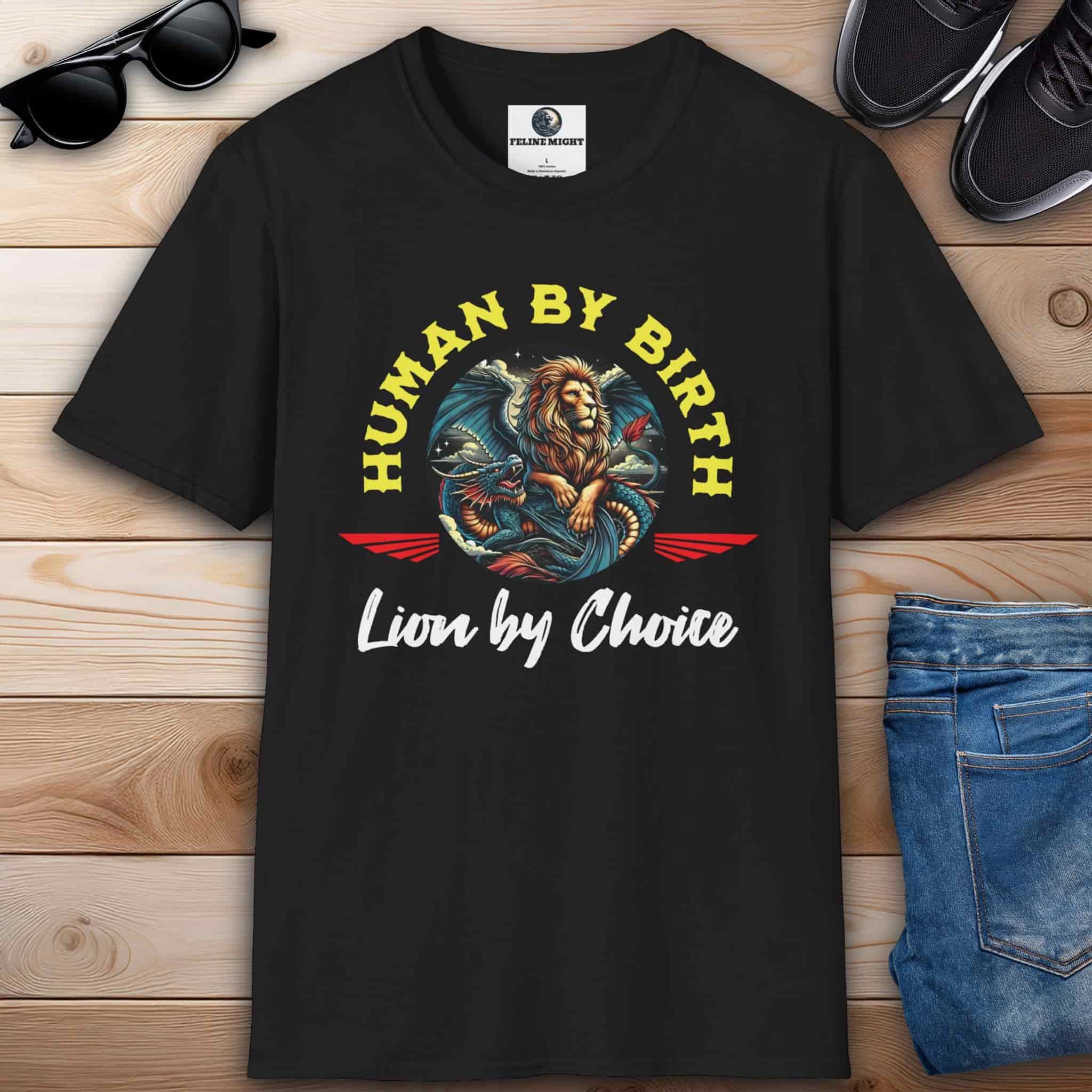 A black Lion Emblem Graphic T-Shirt on a wooden surface, showcasing a bold design for those who lead boldly and never settle for average.