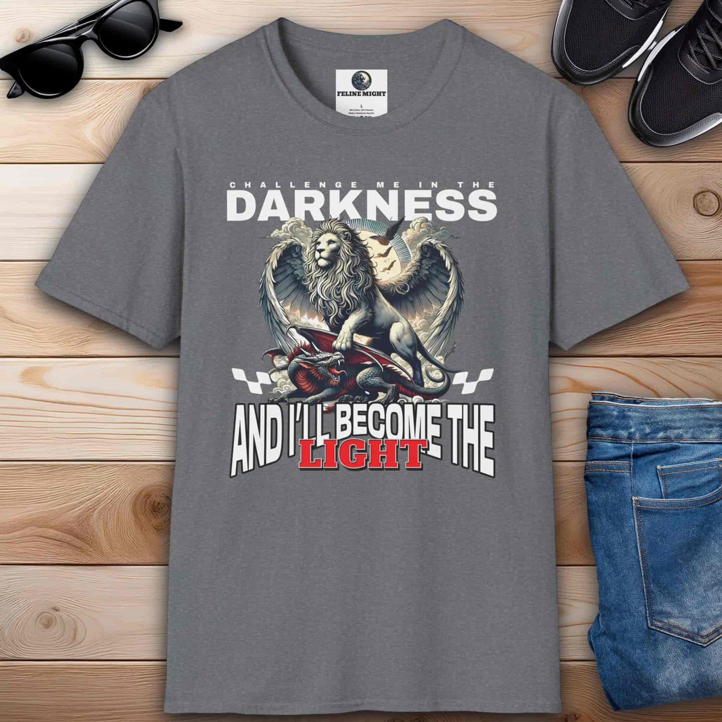 Athletic heather grey t-shirt featuring a lion graphic with the text 'Challenge me in the darkness and I'll become the light.'