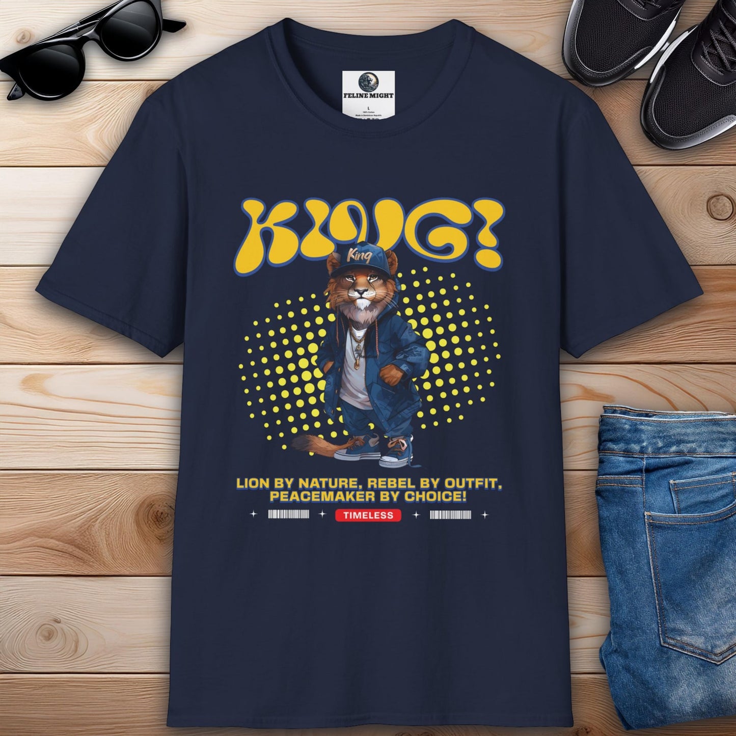 Navy blue t-shirt featuring a lion character with the text 'KING! King' and the phrase 'Lion by nature, rebel by outfit, peacemaker by choice!'