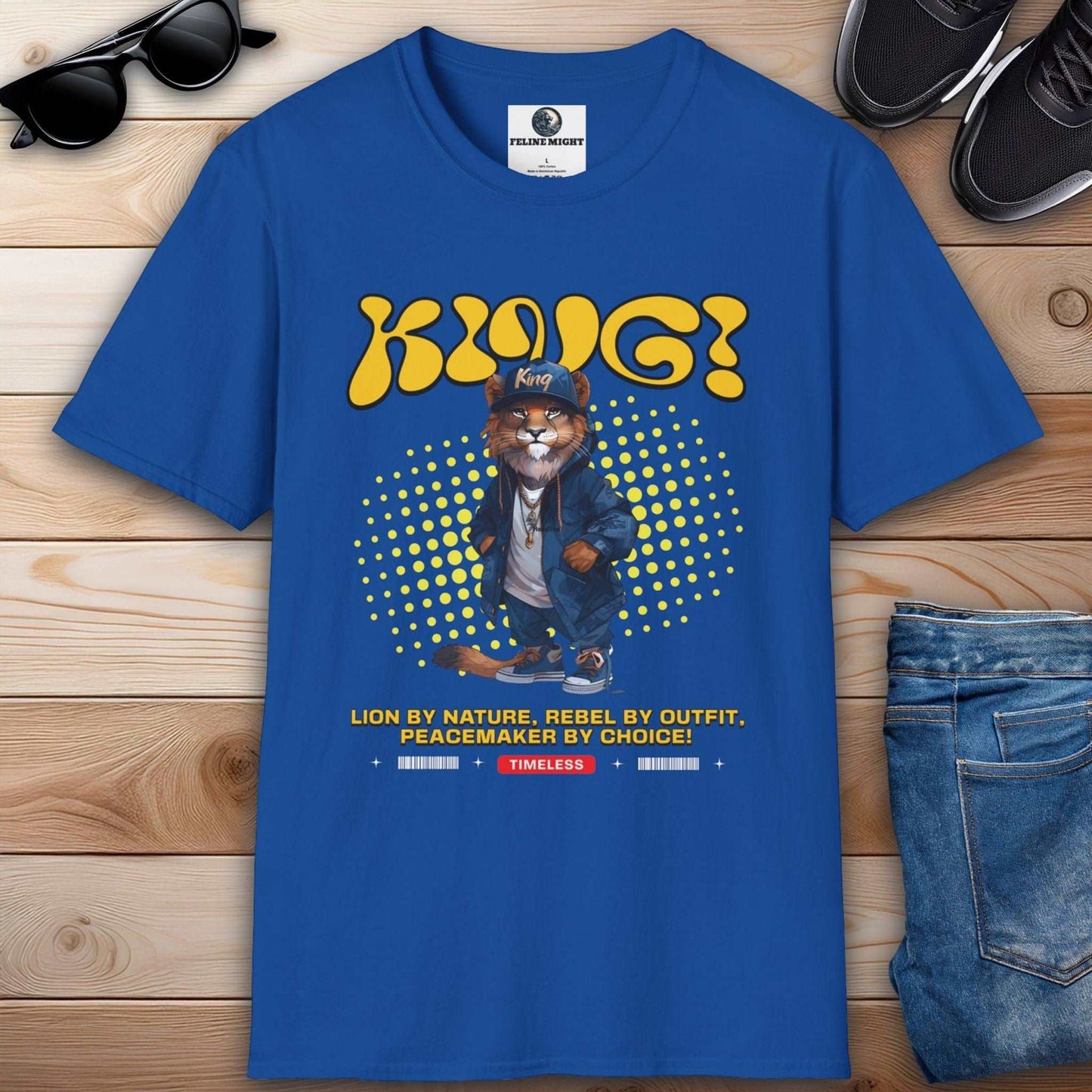 Royal blue t-shirt featuring a lion character with the text 'KING! King' and the phrase 'Lion by nature, rebel by outfit, peacemaker by choice!'