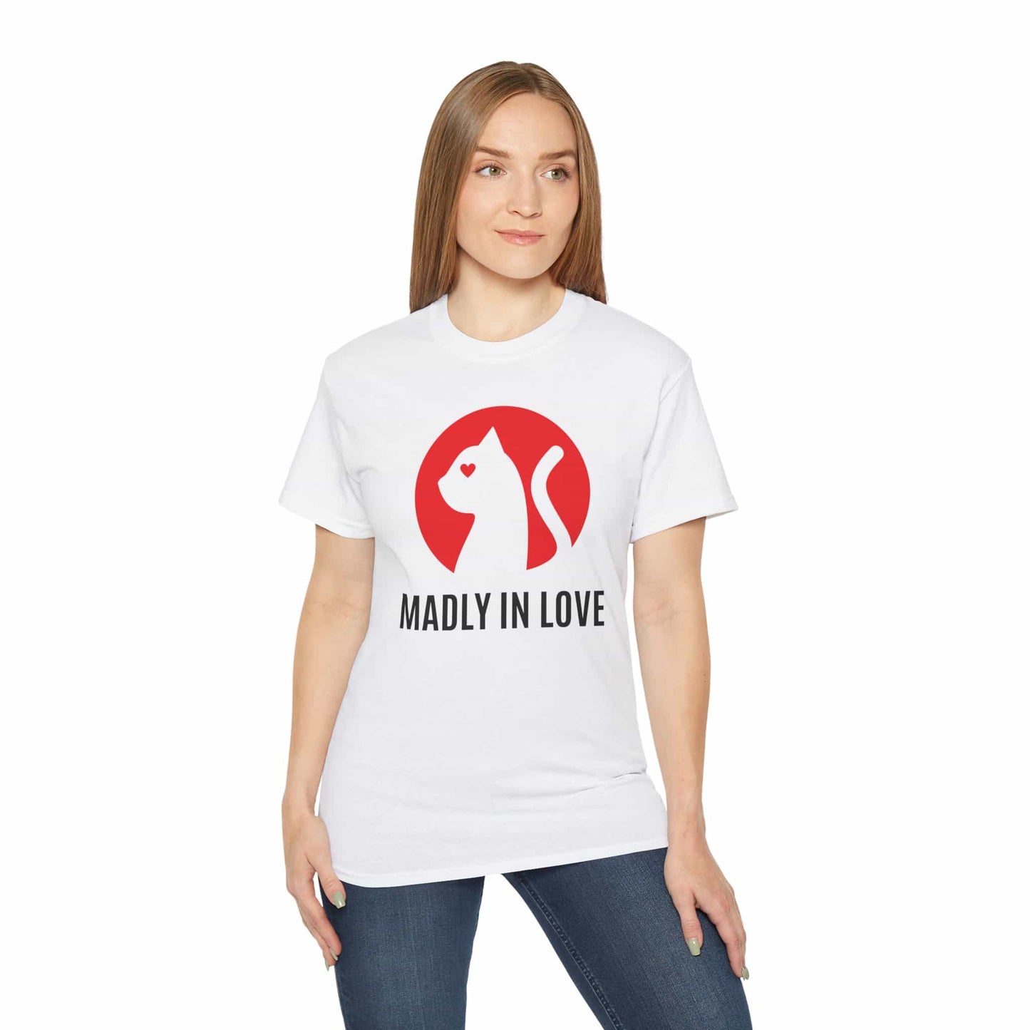 A woman wearing a white Madly in Love Cat T-Shirt featuring a cat silhouette on a red circle, a perfect romantic gift for cat lovers.