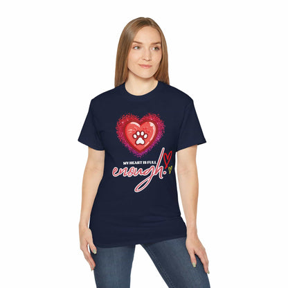 A woman wearing a navy blue My Heart is Full Cat T-shirt with a heart and paw print design on a white background.