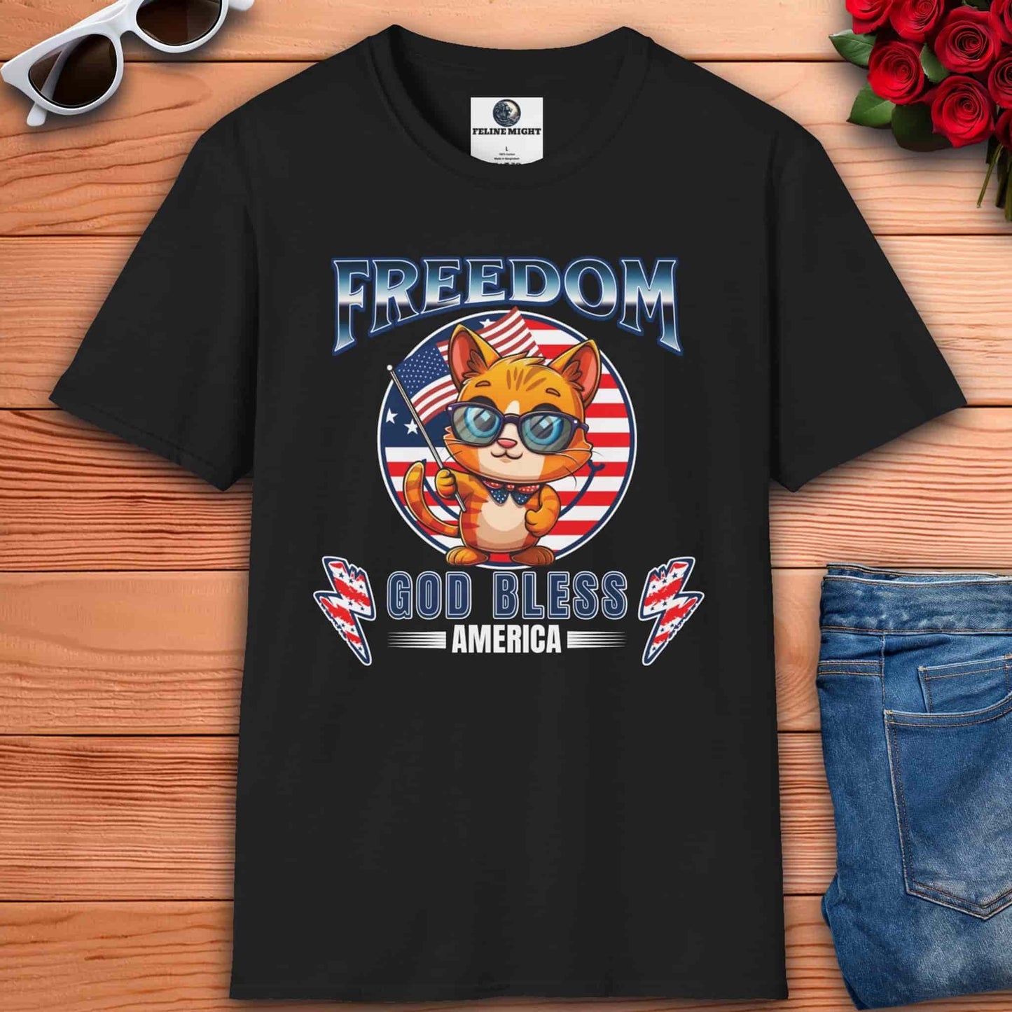 A black Patriotic Cat Freedom T-Shirt featuring a cartoon cat with glasses and an American flag design, celebrating freedom and patriotism.