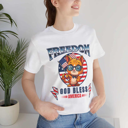 A white Patriotic Cat Freedom T-Shirt worn by a woman, featuring a cat graphic celebrating freedom and American pride.