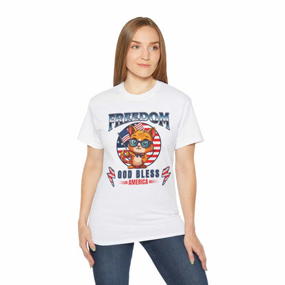 A white Patriotic Cat Freedom T-Shirt worn by a woman, featuring a cat graphic celebrating freedom and American pride, on a white background.