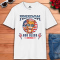 A white Freedom Cat Graphic T-Shirt featuring a cartoon cat with glasses and an American flag design, celebrating freedom and patriotism.