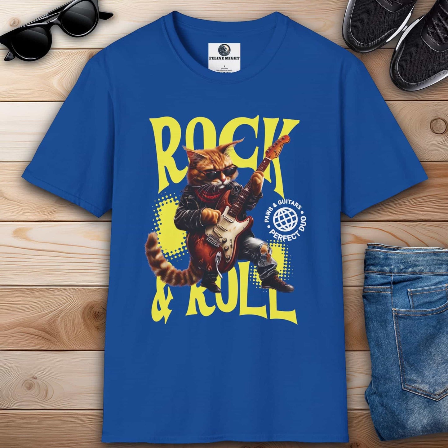 A cartoon cat dressed as a rockstar playing guitar on a stylish royal blue t-shirt