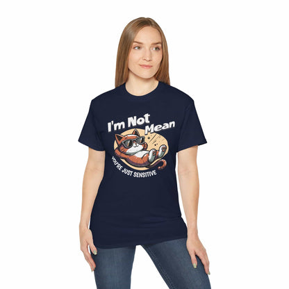A woman wearing a navy blue Sarcastic Cat Humor T-Shirt with a graphic of a cat wearing sunglasses and the text 'I'm Not Mean, You're Just Sensitive'.