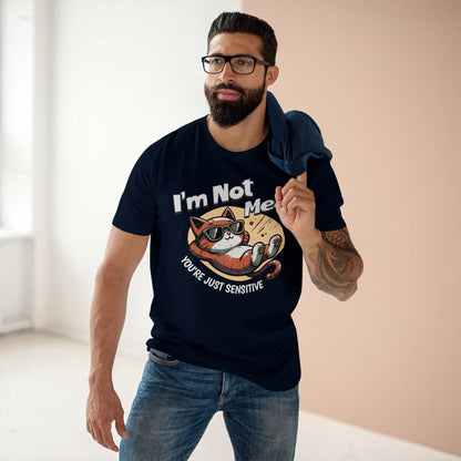 A man wearing a navy blue Sarcastic Cat Humor T-Shirt with a graphic of a cat wearing sunglasses and the text 'I'm Not Mean, You're Just Sensitive'.