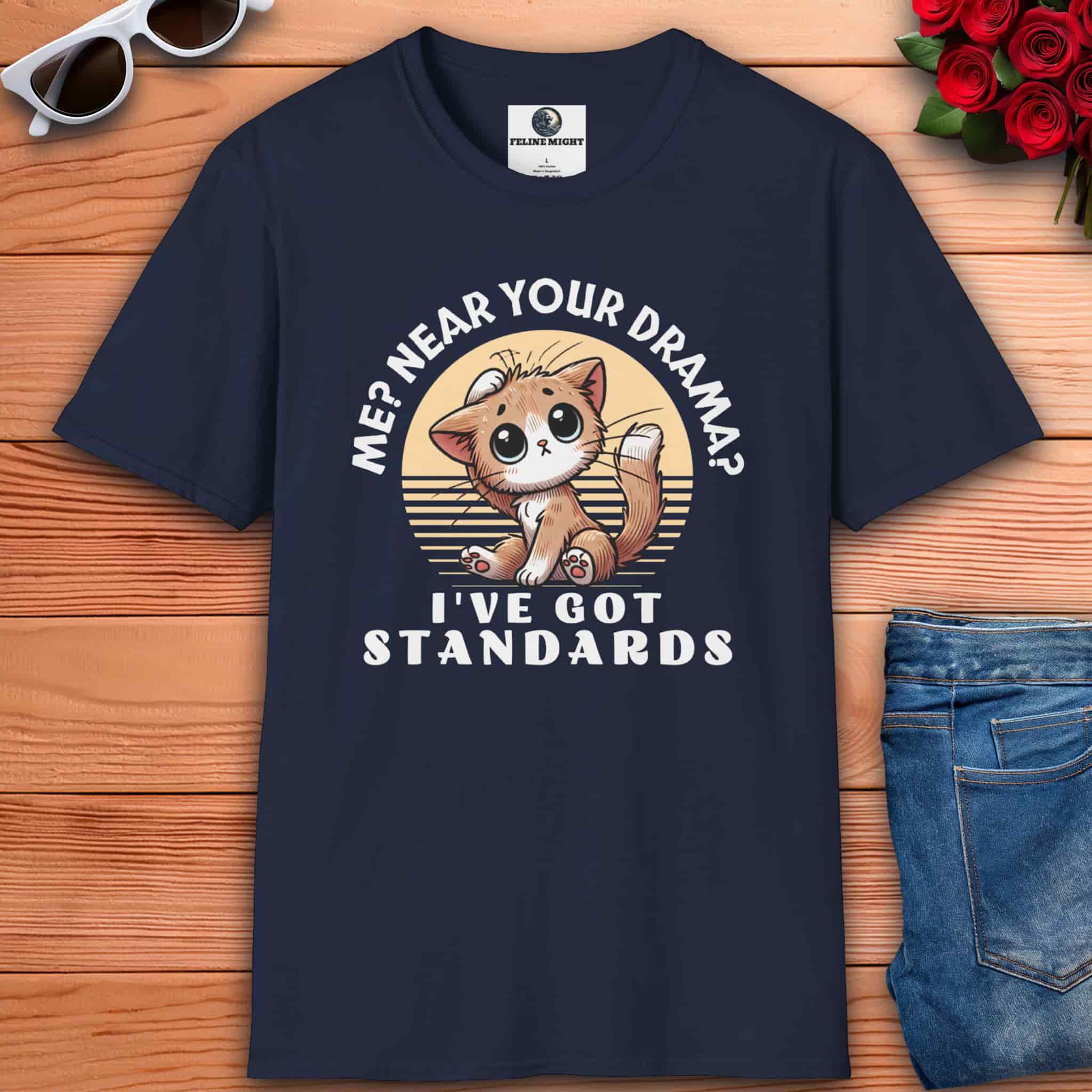 A navy blue Sassy Cat Funny T-Shirt featuring a humorous design with a cute cat and text saying 'Me? Near Your Drama? I've Got Standards.'
