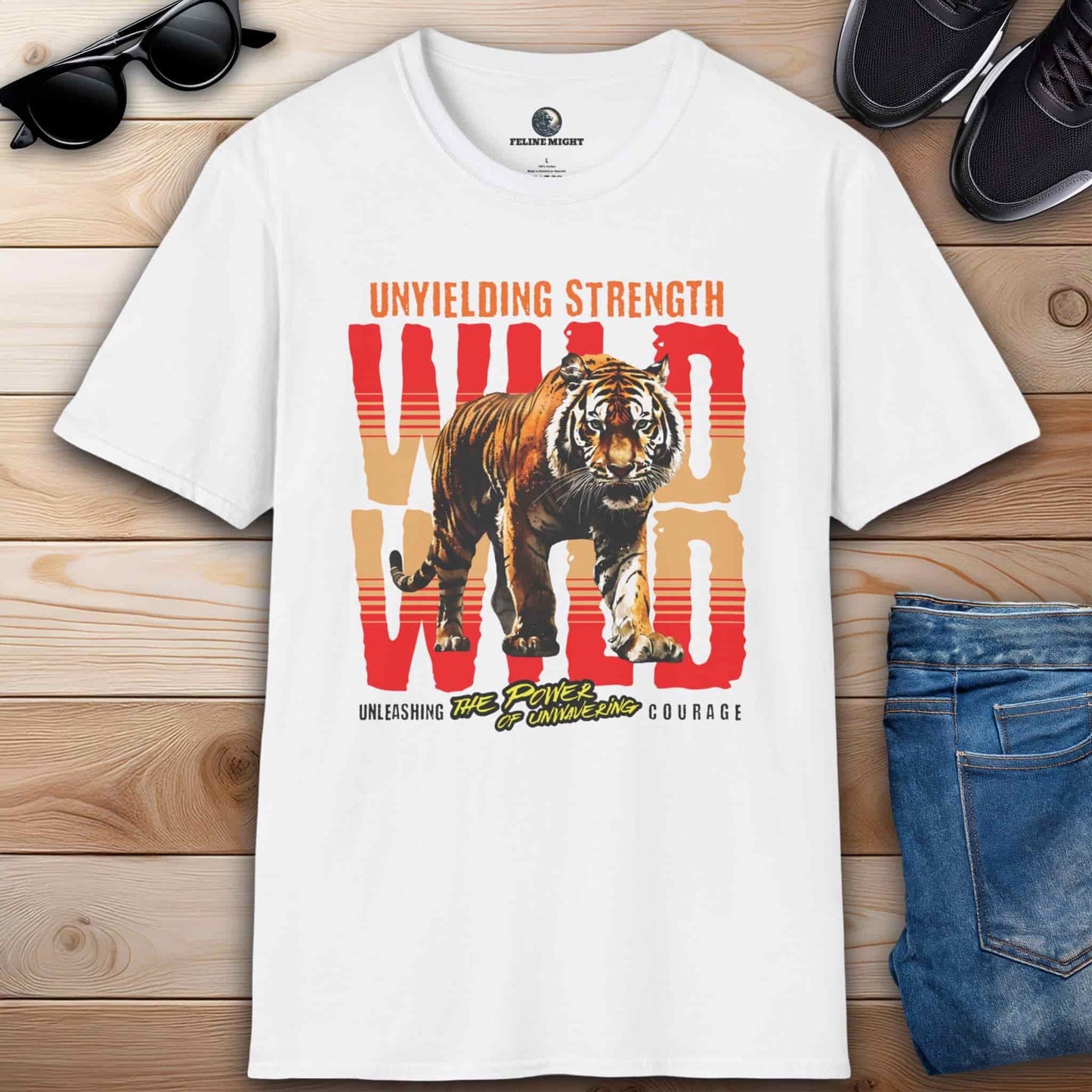 White t-shirt featuring a fierce tiger design with the words 'Unyielding Strength Wild' and 'Unleashing the Power of Unwavering Courage'.