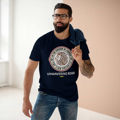 A man wearing a Unwavering Roar Lion T-Shirt featuring a lion graphic and bold text design on a navy blue unisex premium tee, standing indoors.