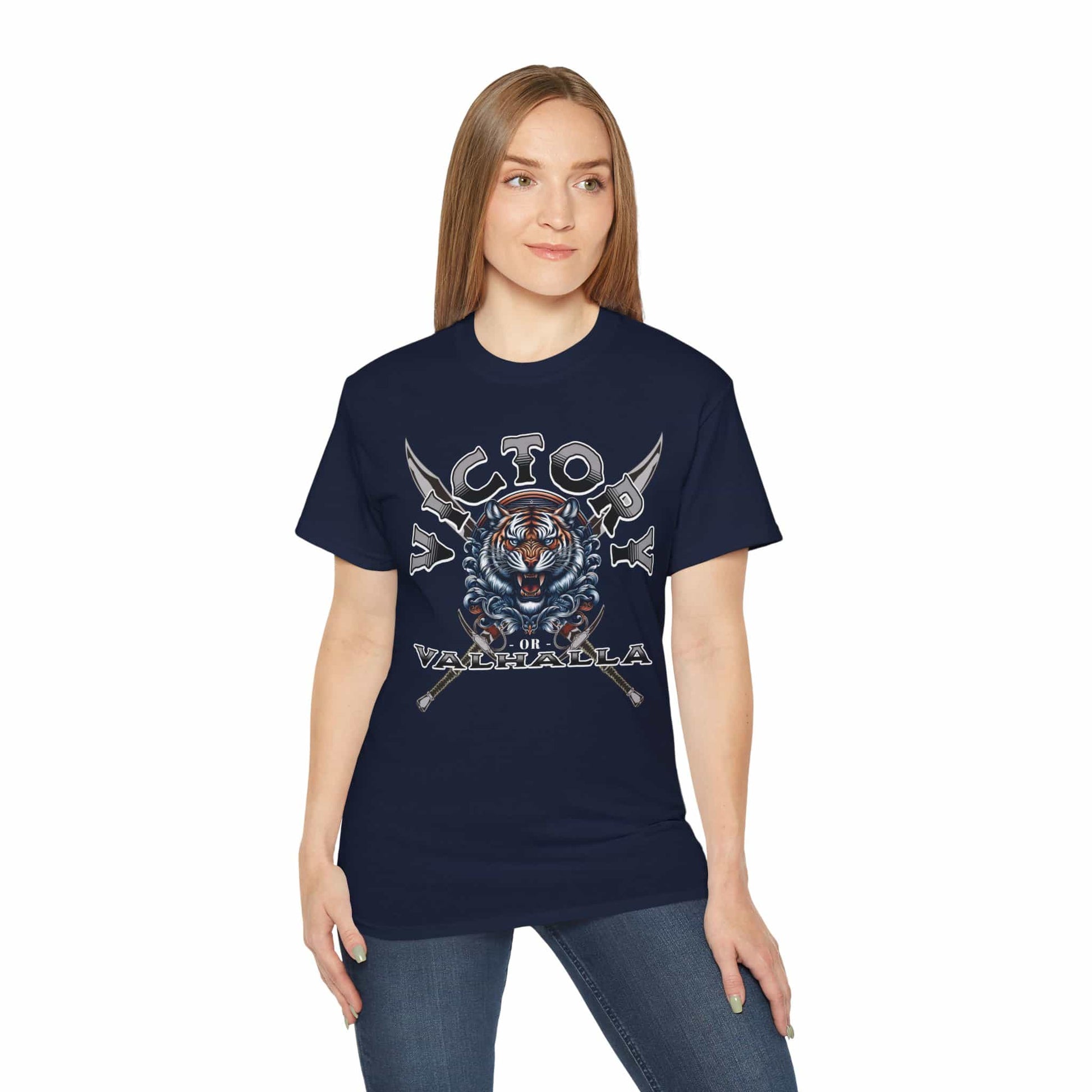 A woman wearing a navy blue Victory or Valhalla Tiger T-Shirt featuring bold design with tiger and crossed swords.