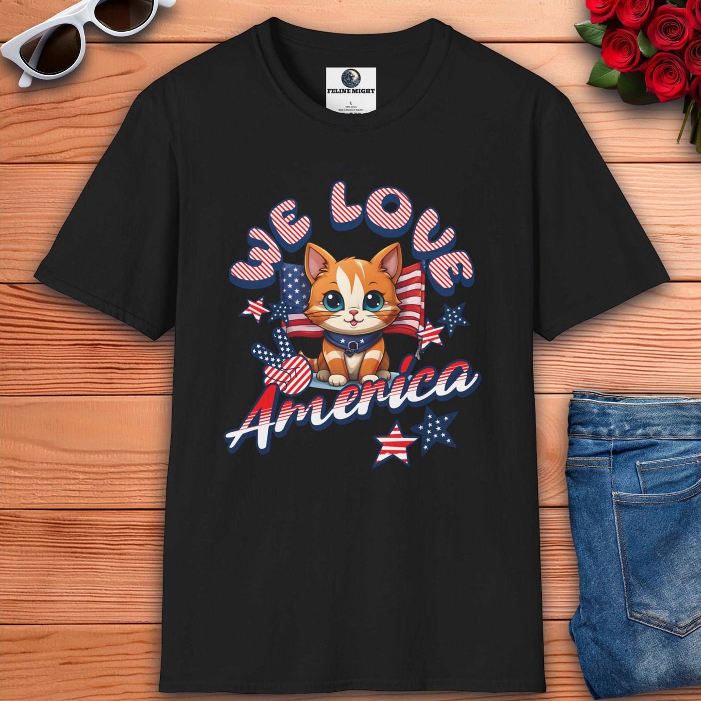 Black t-shirt featuring cute cat design with 'We Love America' text and patriotic elements