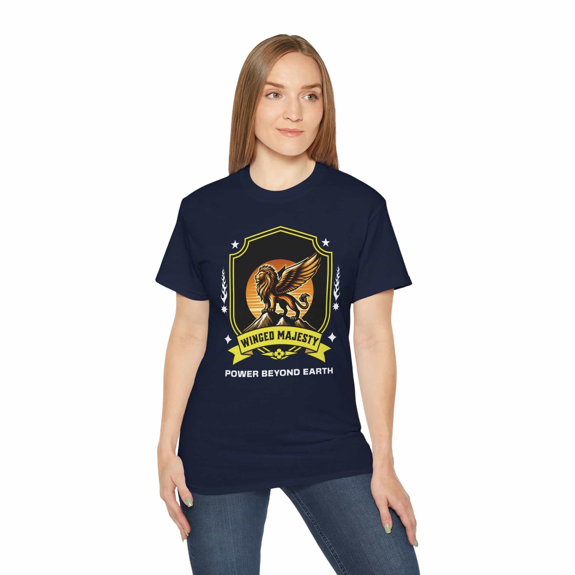 A man wearing a navy blue Winged Majesty Lion T-Shirt featuring a golden-winged lion graphic and the text 'Power Beyond Earth'.