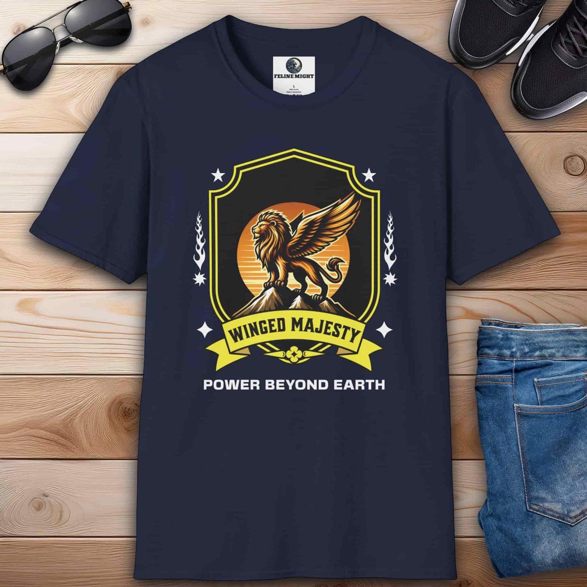 A navy blue Winged Majesty Lion T-Shirt featuring a golden-winged lion graphic and the text 'Power Beyond Earth'.